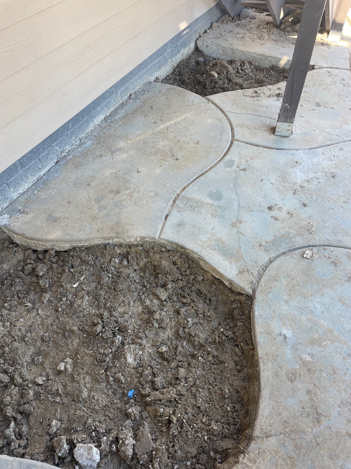 Sinking Sidewalks at an Epp Foundation Repair project