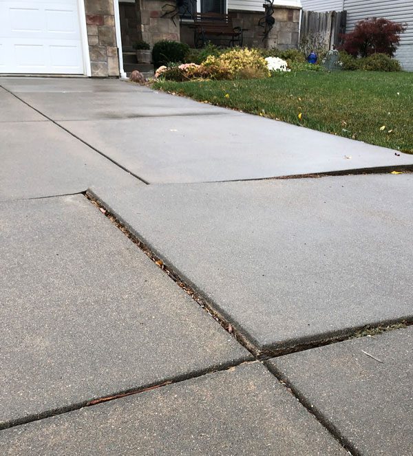 Sinking driveways, sidewalks, or patios.