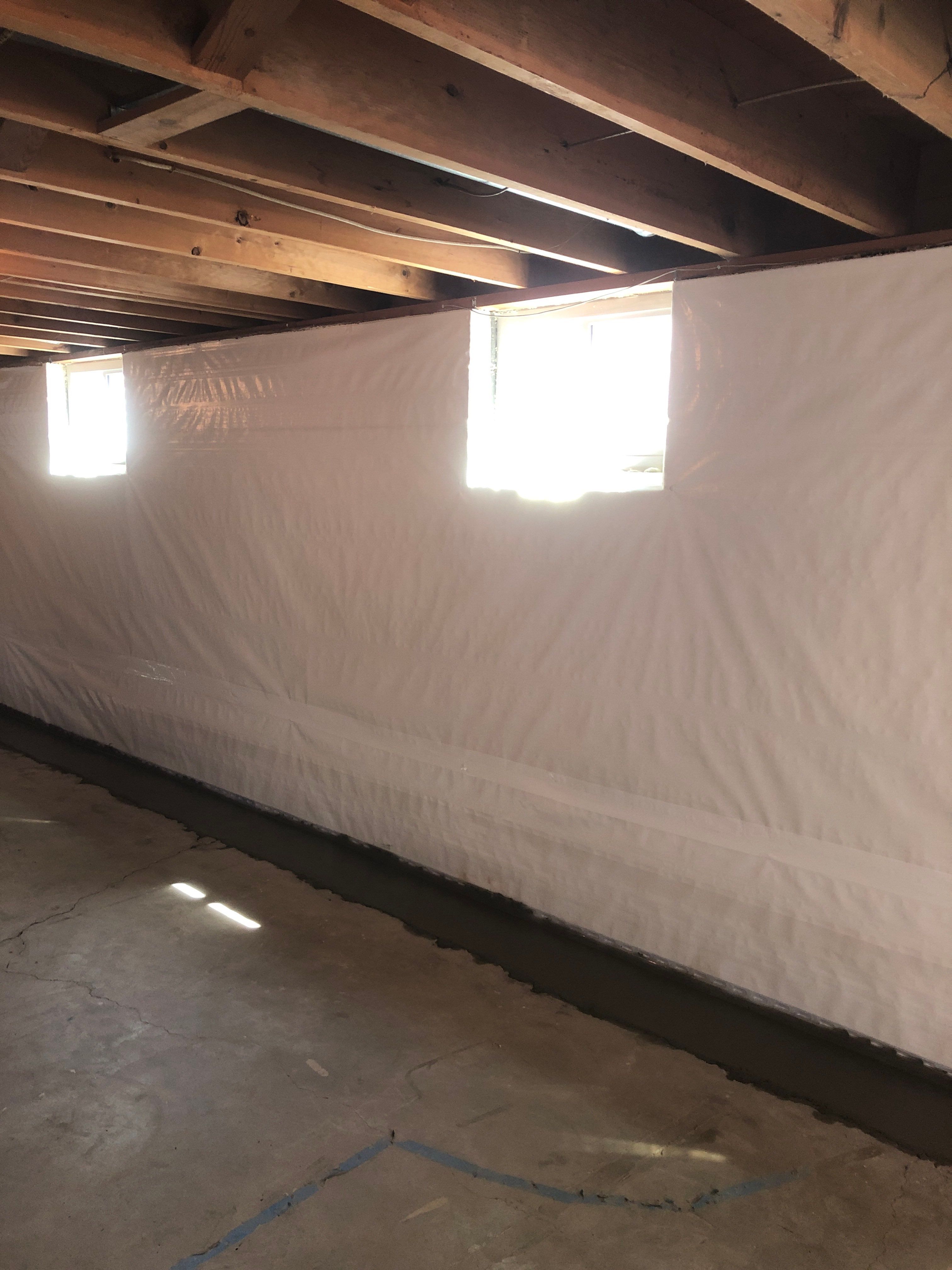 Epp Foundation Repair installing crawl space vapor barrier for moisture control in Lincoln, NE.