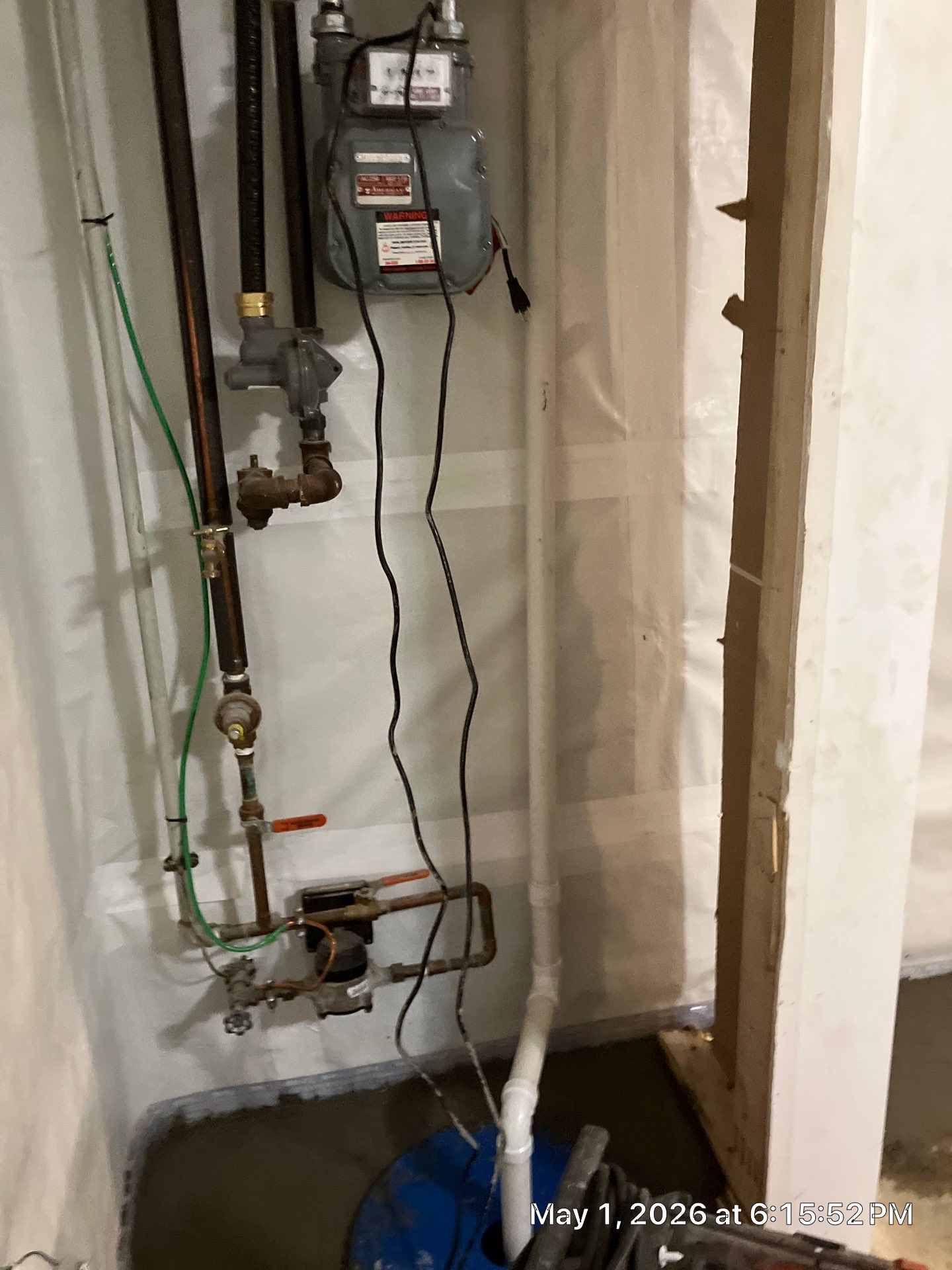 Epp Foundation Repair installing a sump pump and vapor barrier for basement waterproofing in Omaha, Nebraska.