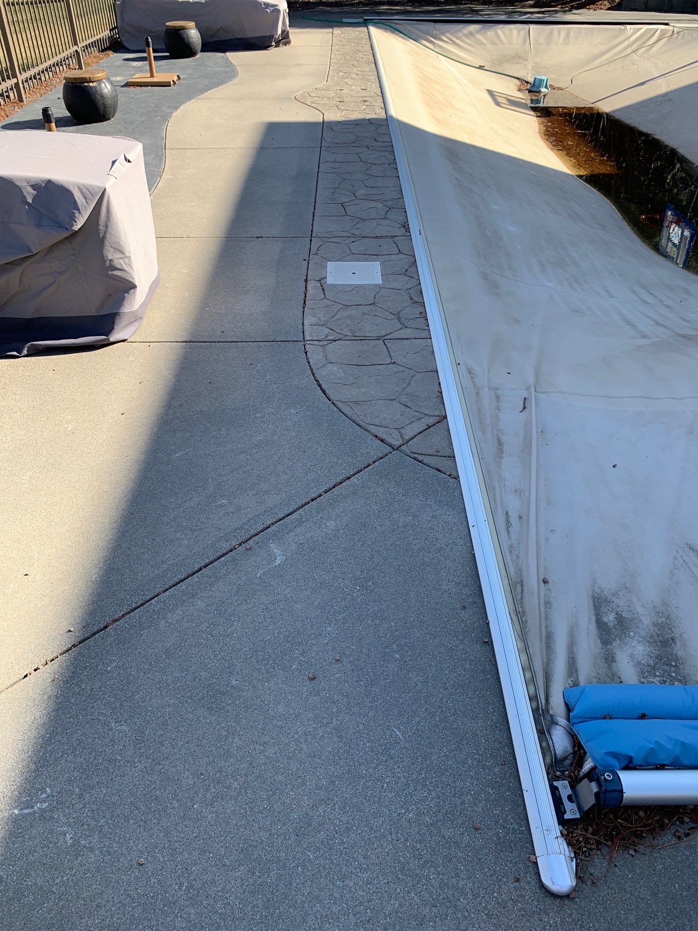 Underlying cause of pool deck settling and tilting around the pool in Midwest homes