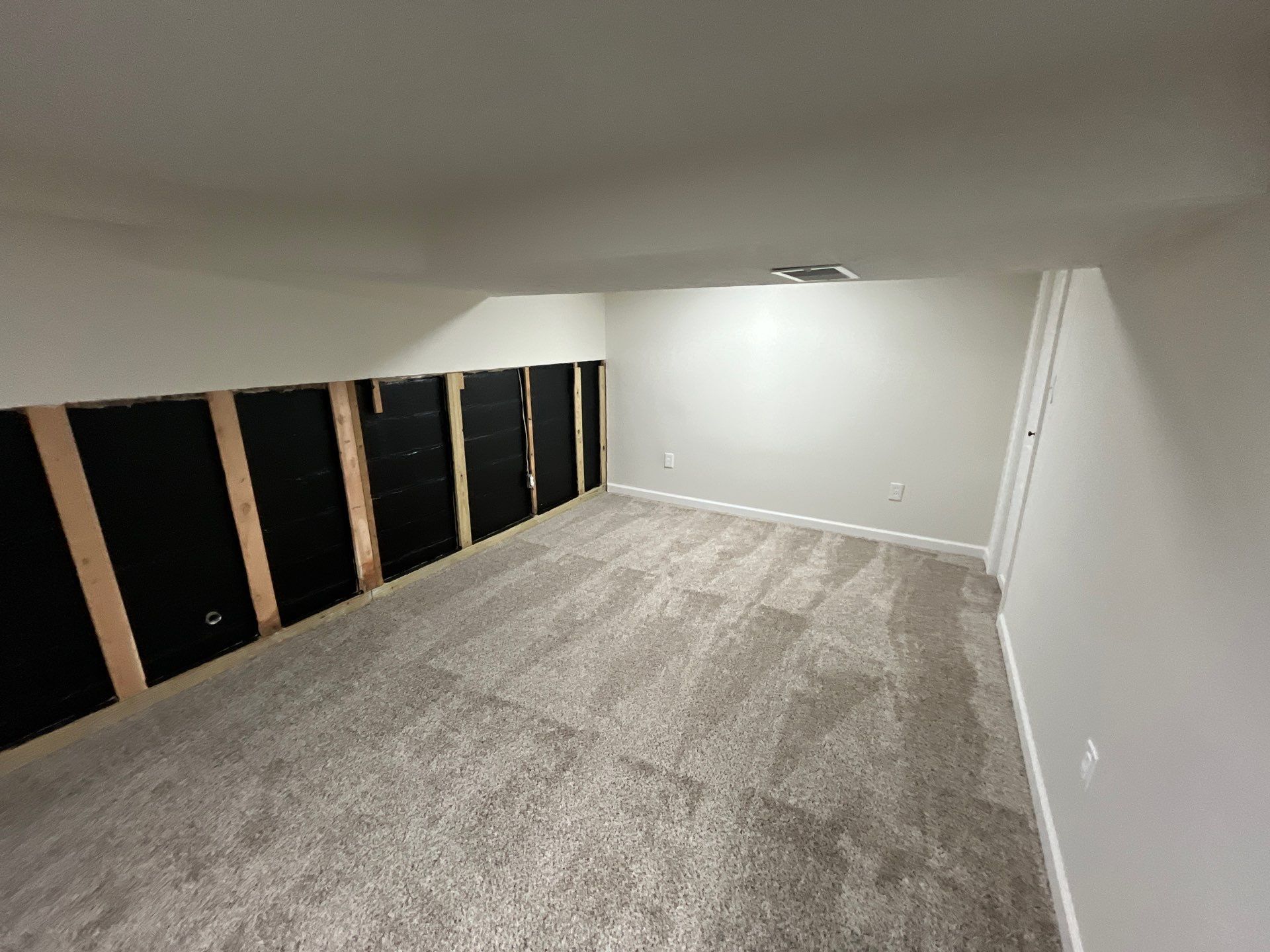 Epp Foundation Repair converting a basement to a living space with moisture control and new carpet in Omaha, NE.