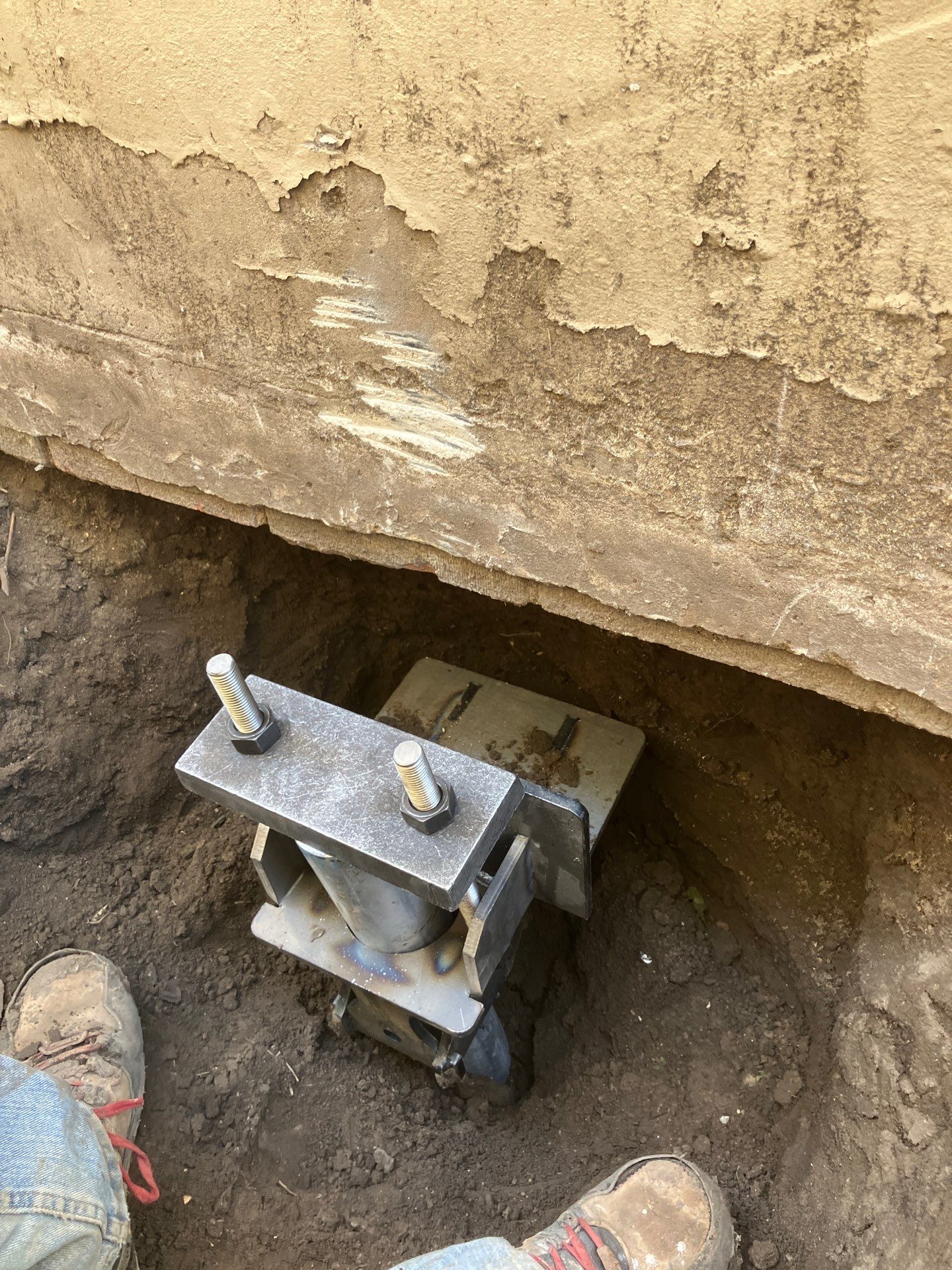 Epp Foundation Repair installing a foundation pier system for structural support in Des Moines, Iowa.