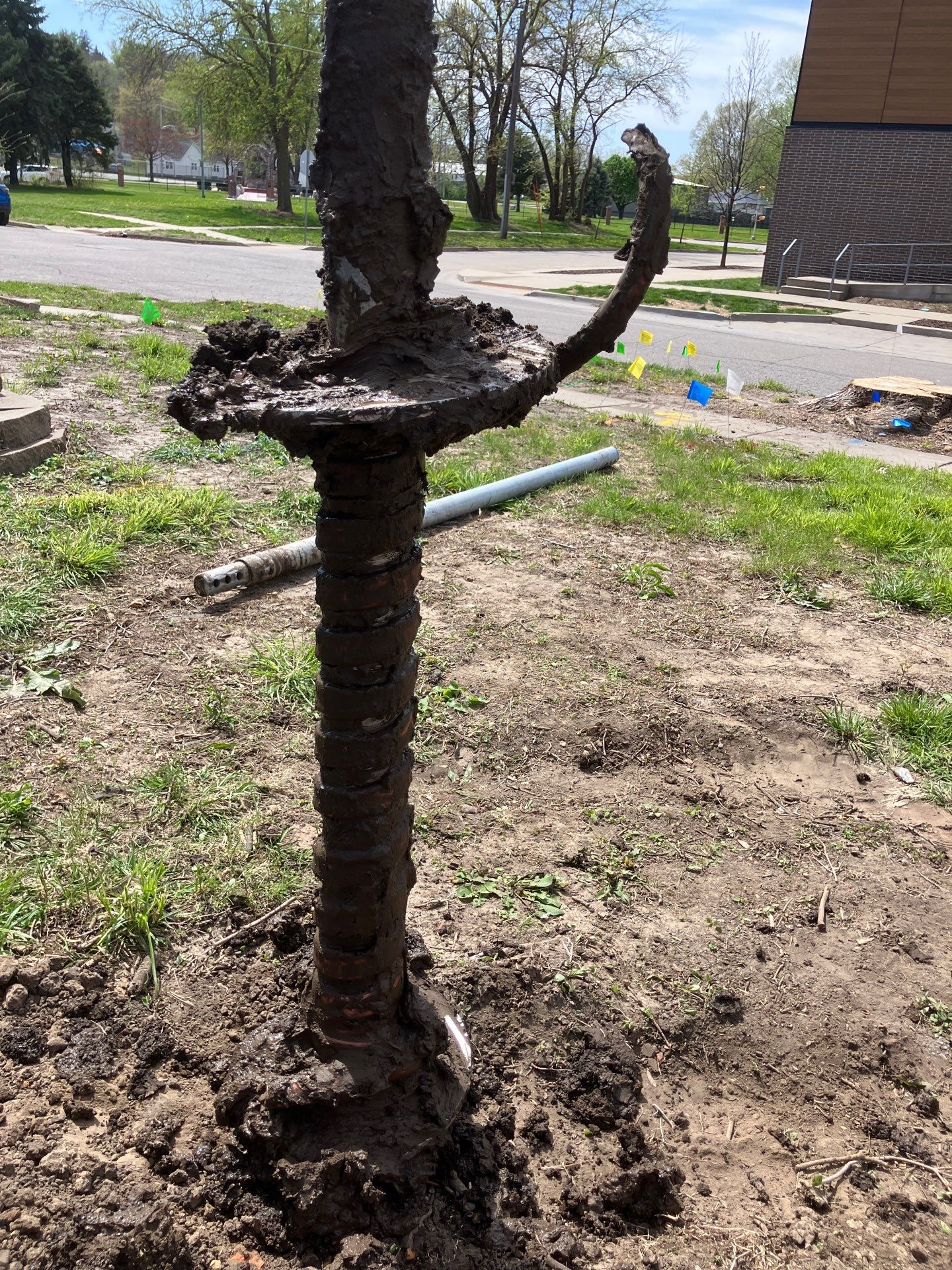 Epp Foundation Repair installing a foundation pier system into the soil in Des Moines, Iowa.